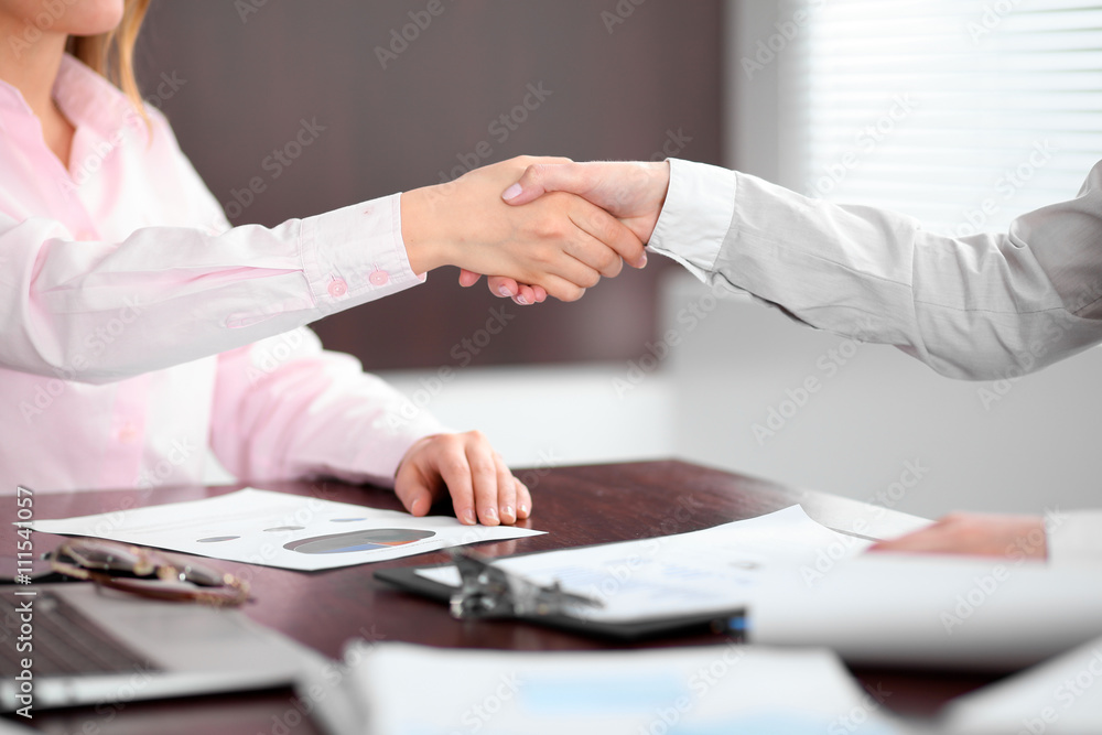 Business people shaking hands, finishing up a meeting Business people shaking hands, finishing up a meeting