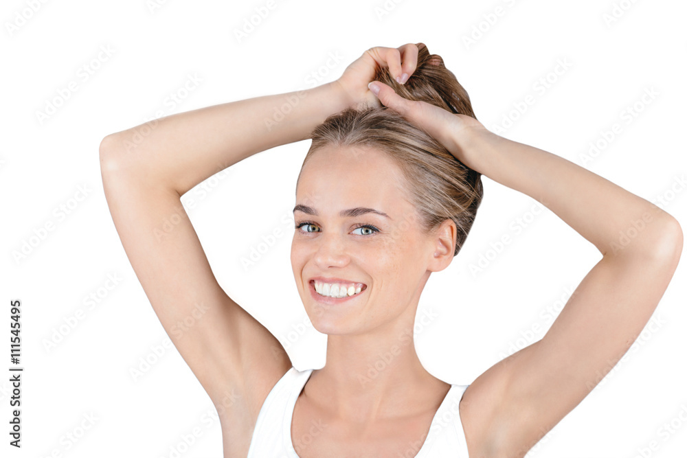 Beautiful girl holds her hair and smiling Beautiful girl holds her hair and smiling