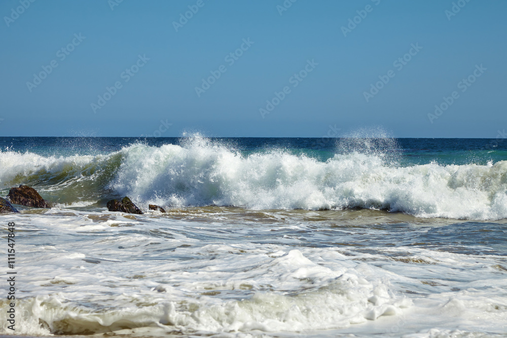 Waves beating against coastal rocks on the cliffs