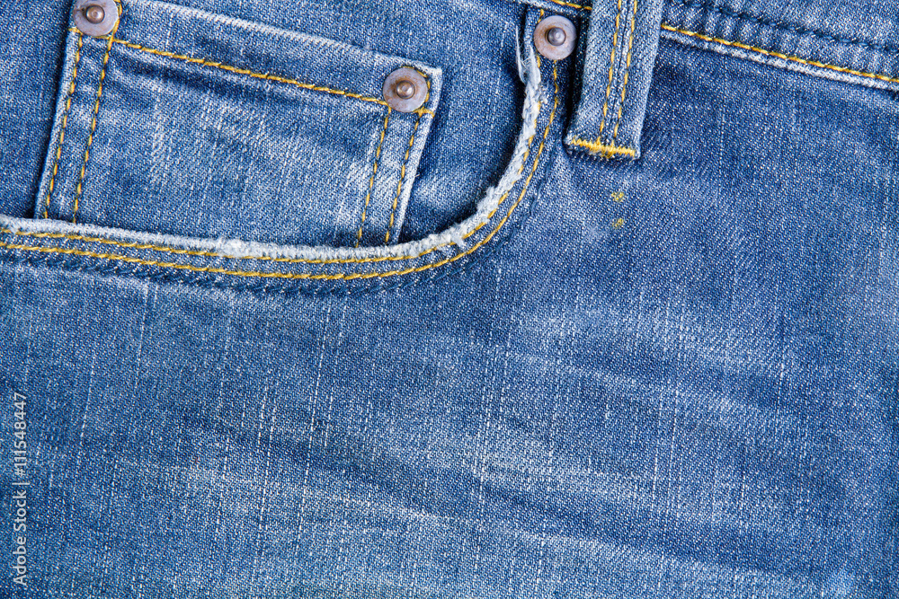 Plastic flowers in the back pocket jeans.Jeans background Plastic flowers in the back pocket jeans.Jeans background
