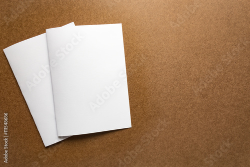 Brown paper note on business wood desk with copy space.