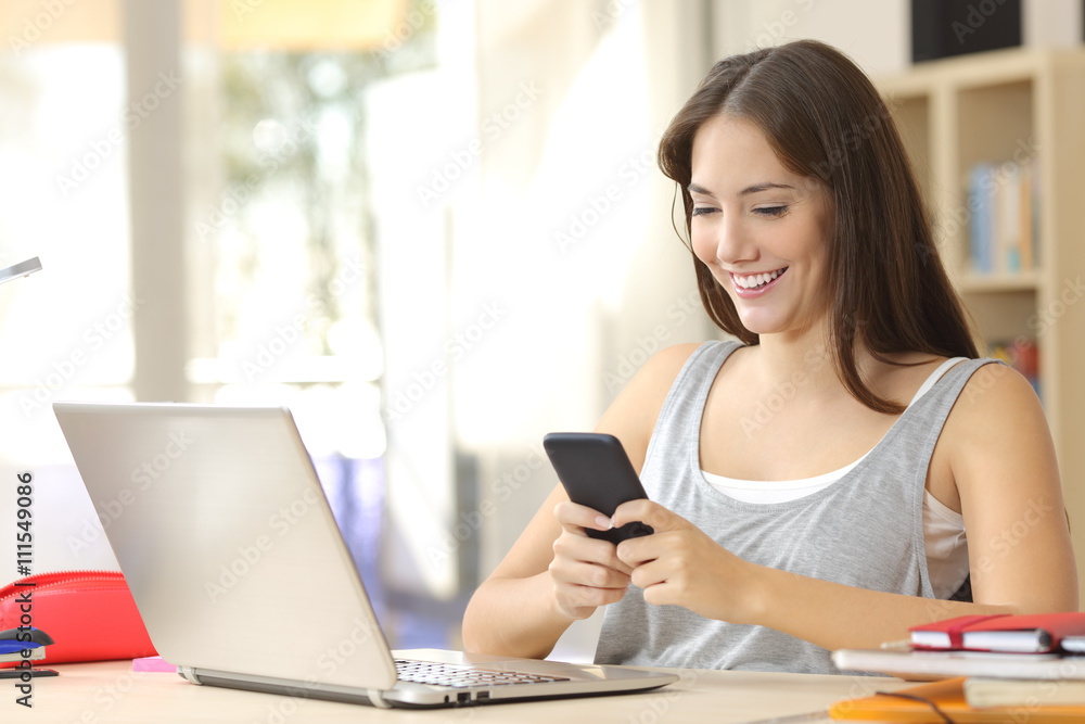 Student learning with laptop and mobile phone Student learning with laptop and mobile phone