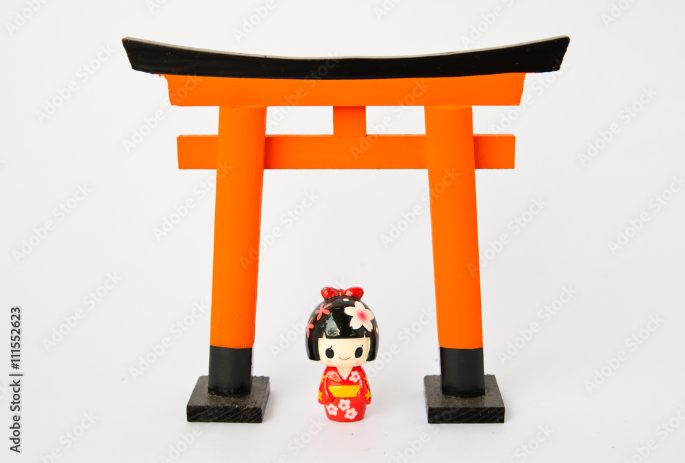 Fototapeta premium Torii gate with Japanese dolls on white background