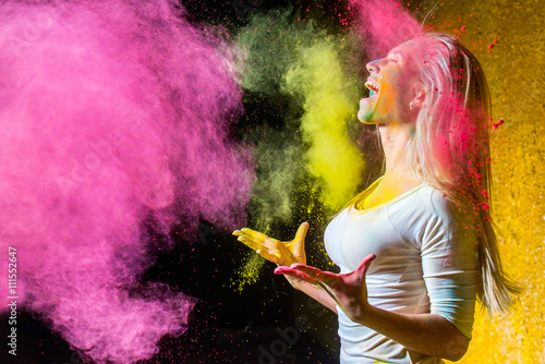 Girl with holi paints photo