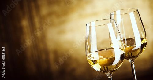 Banner of Two glasses of white wine with copy space photo