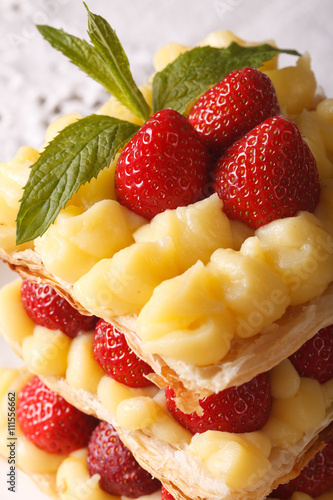 French millefeuille dessert with strawberries macro. vertical photo
