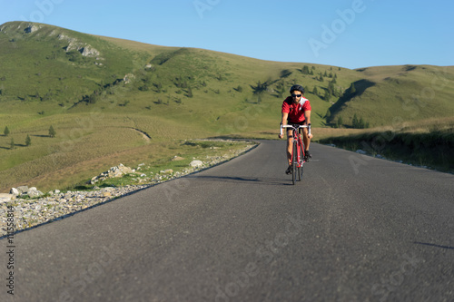 biker cycling on road