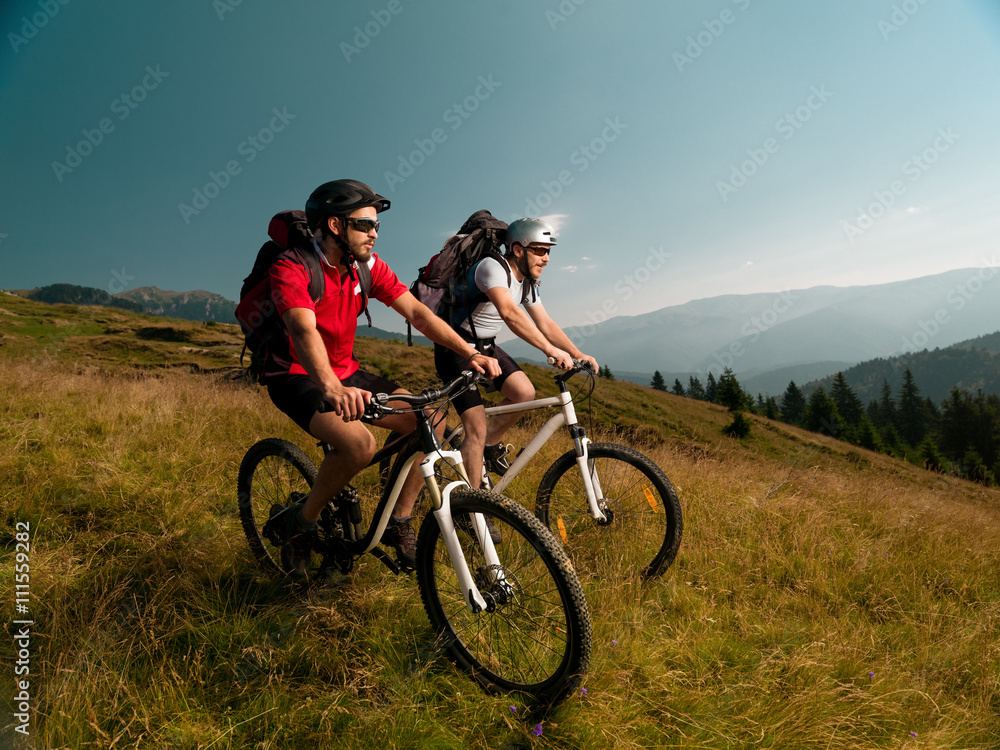 men riding mountain bikes