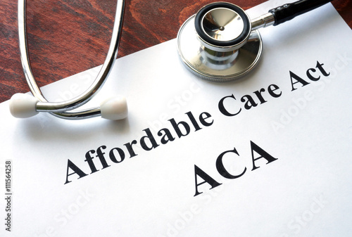 Words Affordable Care Act  ACA written on a paper. photo