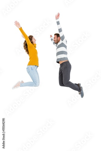 Happy couple jumping in excited