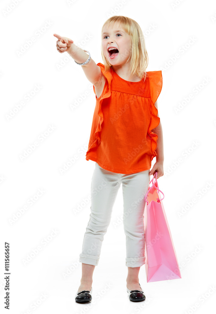 Girl with shopping bag on white background pointing on something Girl with shopping bag on white background pointing on something