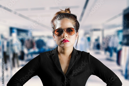 fashionable woman with model wearing sunglasses, black long sleeves and red lips