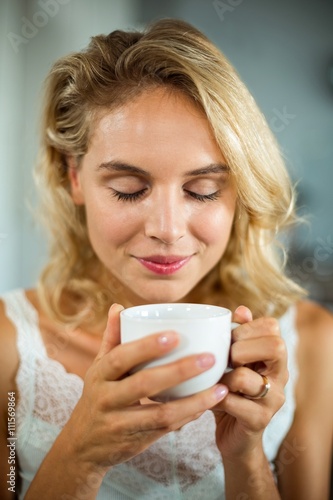 Close-up of woman having coffee