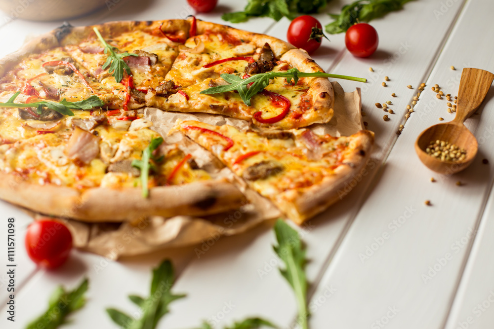 Pizza with salami and tomatoes. Top view Pizza with salami and tomatoes. Top view