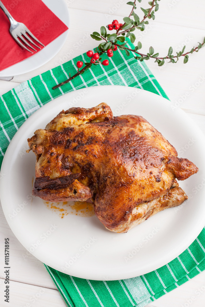 Baked chicken on white plate. Baked chicken on white plate.