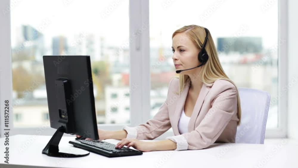 businesswoman with computer and headset talking businesswoman with computer and headset talking