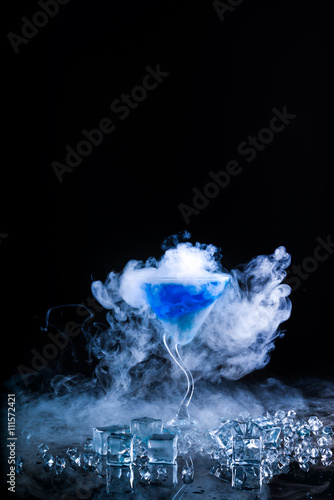 blue cocktail and ice vapor