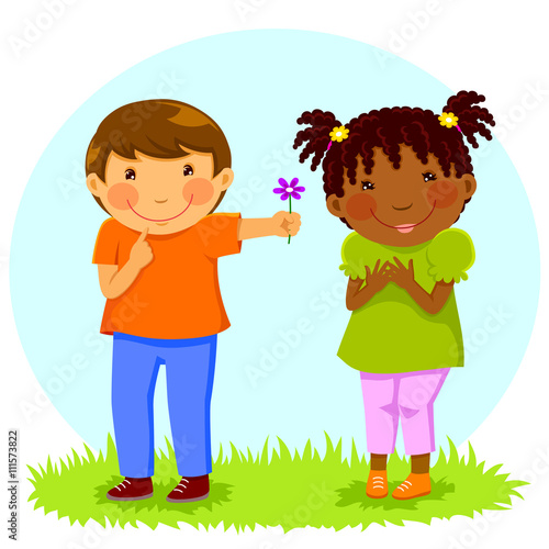 Caucasian boy gives a flower to an African girl
