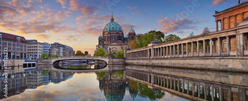 Berlin. Panoramic image of Berlin Cathedral and Museum Island in Berlin during sunrise.  photo