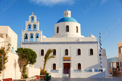 Church in the town square in Oia, Santorini at at sunrise.