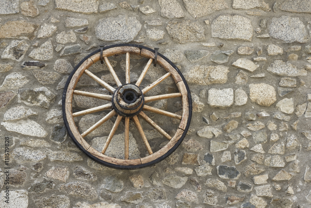 stone wall with chariot wheel