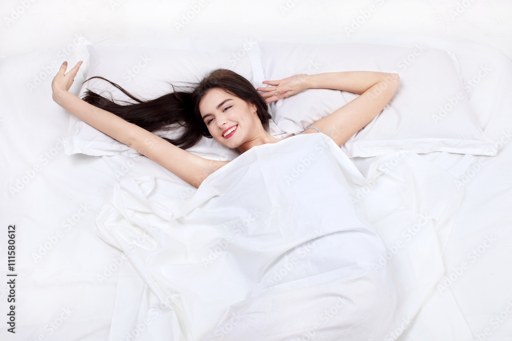 young woman sleeping on the white linen in bed at home, top view young woman sleeping on the white linen in bed at home, top view