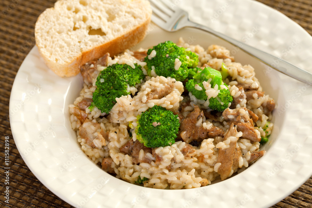 Slow cooked dish with chicken tights, rice and broccoli. Slow cooked dish with chicken tights, rice and broccoli.