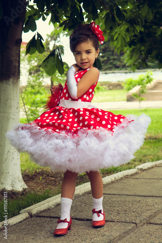 little girl in polka dot dress