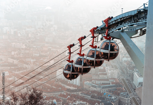 Grenoble, France - December 23, 2015: View of  rooftops of Grenoble and The Grenoble-Bastille cable car also  known as Les bulles