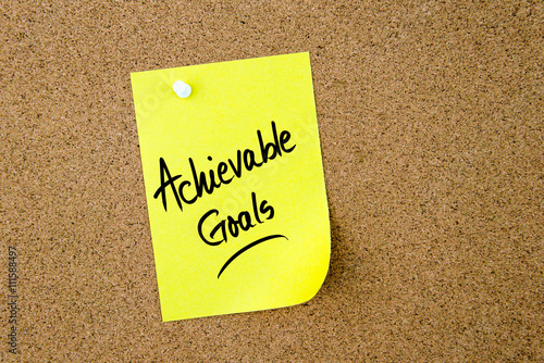 Achievable Goals written on yellow paper note