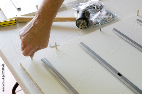 Assembling flatpack cabinet photo