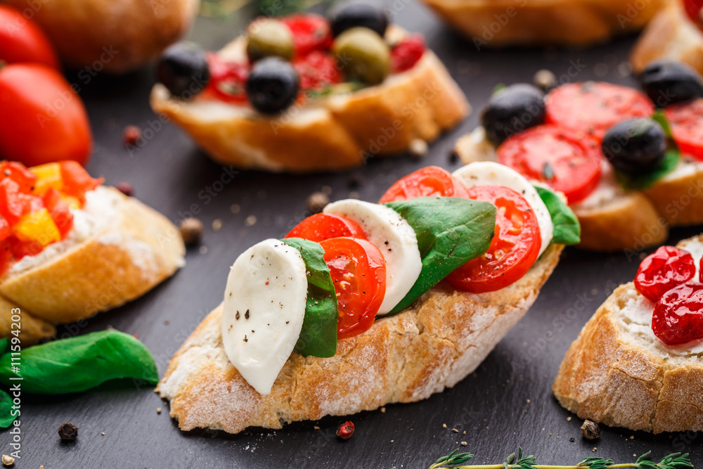 Bruschetta with tomatoes, mozzarella and basil Bruschetta with tomatoes, mozzarella and basil