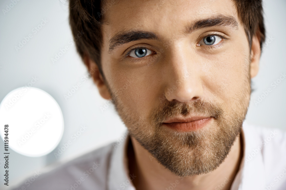 Obraz premium Close up portrait of elegant confident handsome young businessma