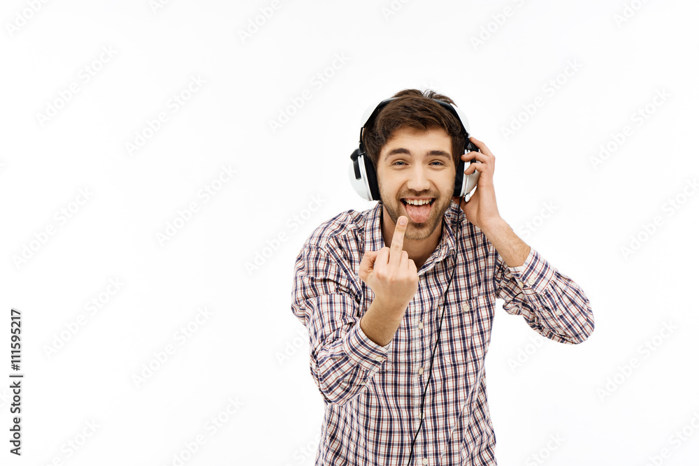 Portrait of handsome confident young man in headphones Portrait of handsome confident young man in headphones