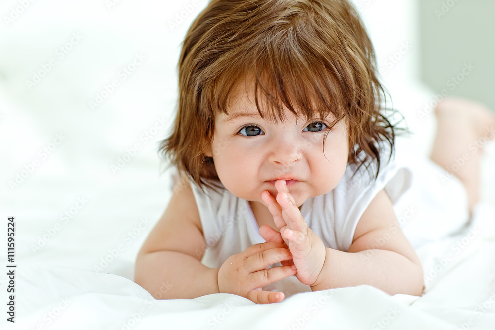 Fototapeta premium Happy baby on the bed 