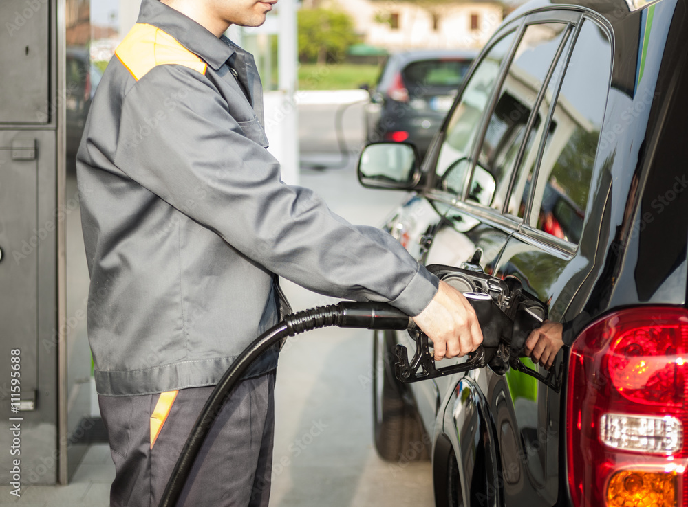 Man fueling up a car Man fueling up a car