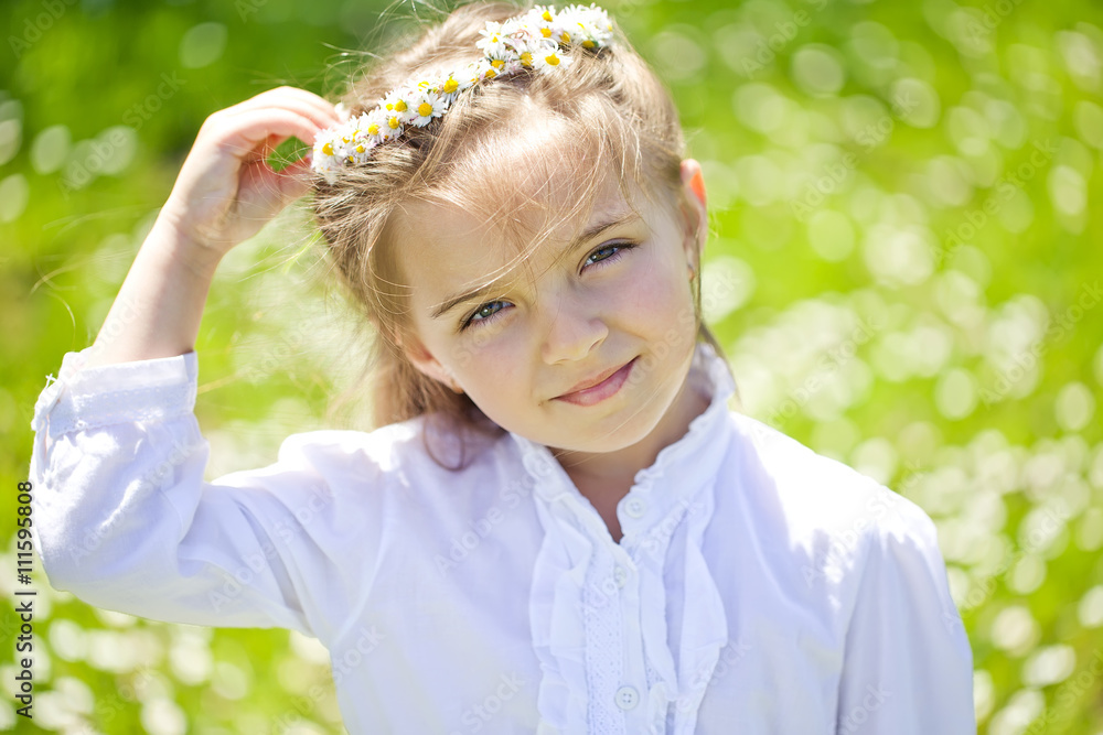 Happy kid in a camomile field Happy kid in a camomile field