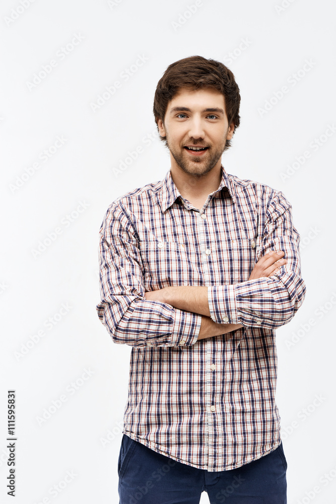 Portrait of handsome confident young man with crossed hands Portrait of handsome confident young man with crossed hands
