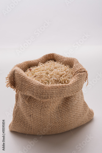Brown rice in burlap sack