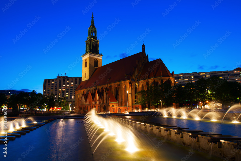 St Marys Church in Berlin, Germany, with fountain in front at night