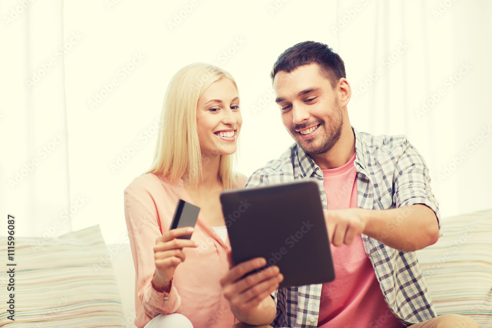 happy couple with tablet pc and credit card happy couple with tablet pc and credit card