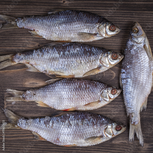 Dry fish on a wooden background