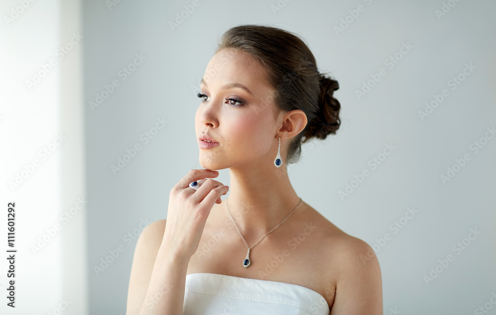 beautiful woman with earring, ring and pendant beautiful woman with earring, ring and pendant