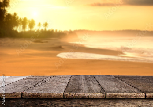 Summer sandy beach with wooden planks