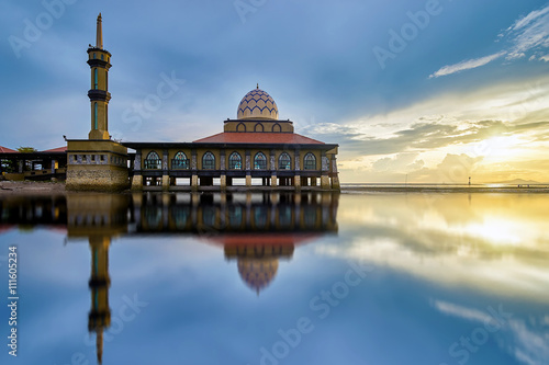 Beautiful mosque by the beach at sunset photo