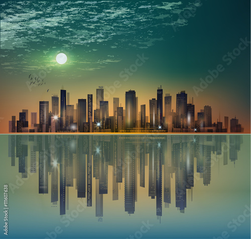 Modern night city landscape in moonlight or sunset, with reflection in water and cloudy sky