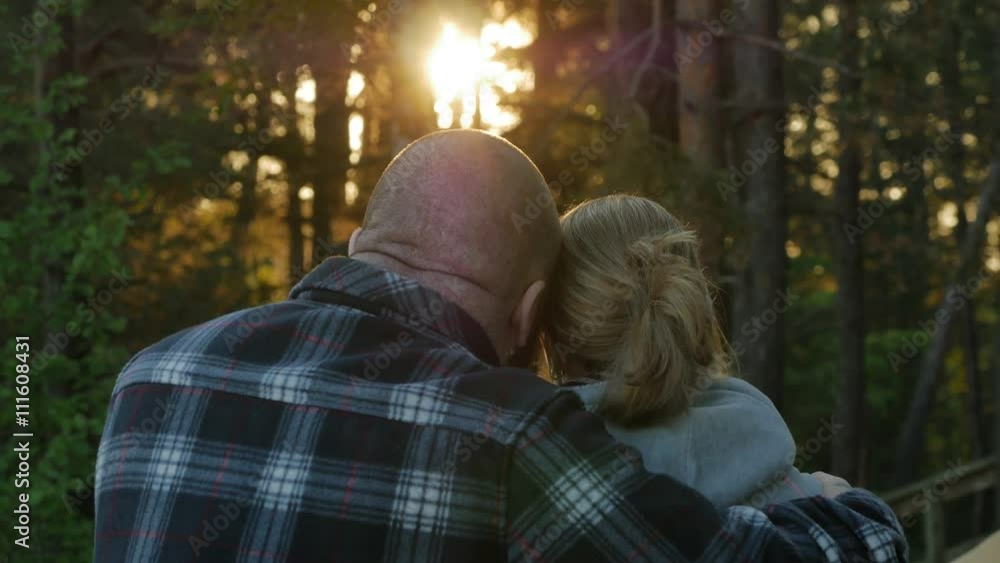 Man and woman together near a baltic sea in spring. Sunrise, sea and forest. 4K UHD. Man and woman together near a baltic sea in spring. Sunrise, sea and forest. 4K UHD.
