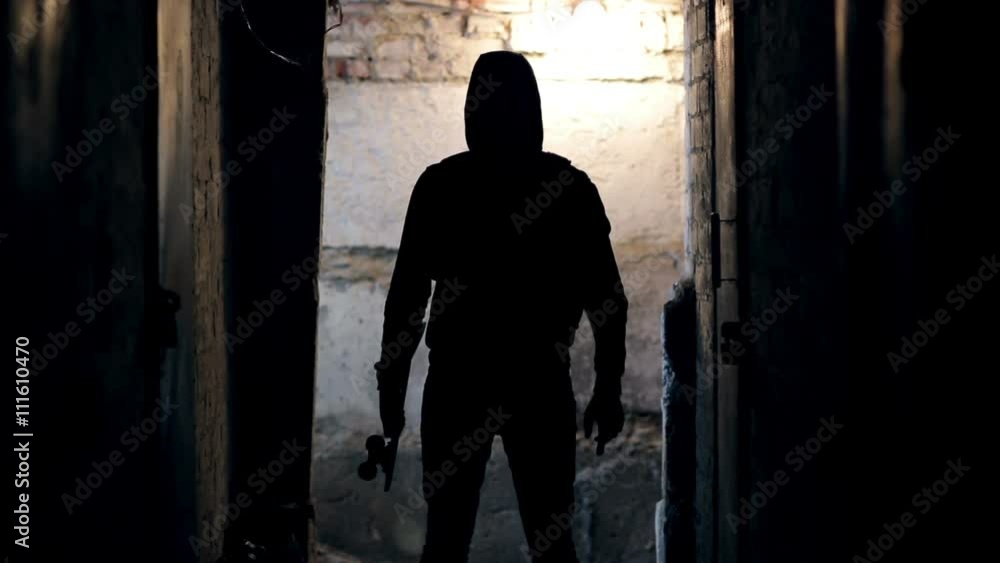 Man stands in dark tunnel Man stands in dark tunnel