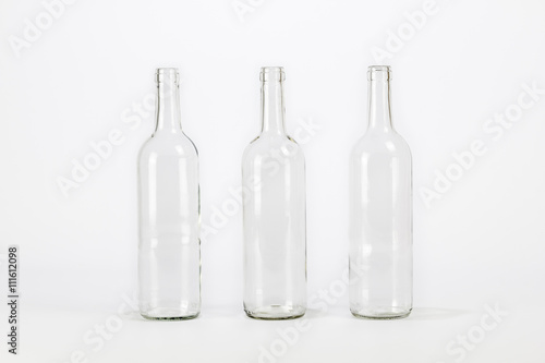 Three empty glass bottle