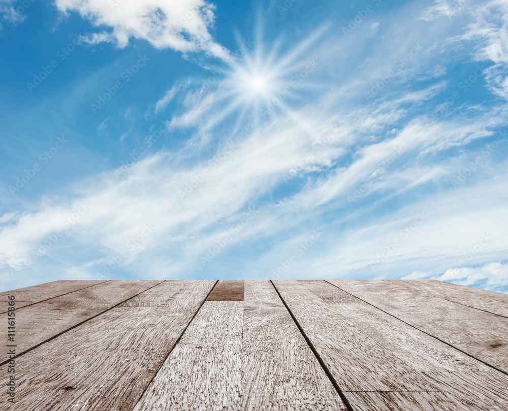 Wooden table top on blue sky